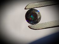 Black rainbow opal 0.50 ct 6 mm