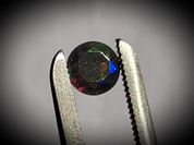 Black rainbow opal 0.50 ct 6 mm