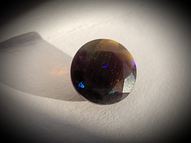 Black rainbow opal 0.50 ct 6 mm